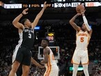 Atlanta Hawks guard Dejounte Murray (5) shoots over San Antonio Spurs forward Keldon Johnson (3) in the second half at the AT&T Center. 