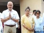 Satish Kaushik's friend Anupam Kher was by his family's side as they greeted mourners at his prayer meet. 