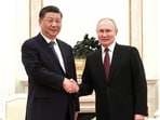 Russian President Vladimir Putin, right, and Chinese President Xi Jinping shake hands prior to their talks at the Kremlin in Moscow, Russia, Monday. Russian President Vladimir Putin, right, and Chinese President Xi Jinping shake hands prior to their talks at the Kremlin in Moscow, Russia, Monday.