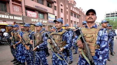 Rapid Action Force (RAF) personnel conduct a flag march to instil a sense of security among the residents on Sunday amid a search operation to nab Waris Punjab De chief Amritpal Singh. (ANI) Rapid Action Force (RAF) personnel conduct a flag march to instil a sense of security among the residents on Sunday amid a search operation to nab Waris Punjab De chief Amritpal Singh. (ANI)