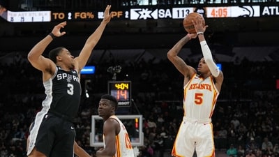 Atlanta Hawks guard Dejounte Murray (5) shoots over San Antonio Spurs forward Keldon Johnson (3) in the second half at the AT&T Center. (USA TODAY Sports)