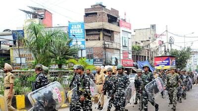 CRPF personnel patrol a street during a hunt for Waris Punjab De chief Amritpal Singh, in Jalandhar on Monday. (ANI) CRPF personnel patrol a street during a hunt for Waris Punjab De chief Amritpal Singh, in Jalandhar on Monday. (ANI)