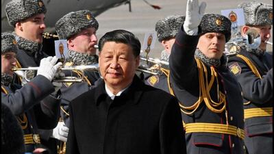 Chinese President Xi Jinping walks past honour guards and members of a military band during a welcoming ceremony upon his arrival at an airport in Moscow, Russia, on Monday. (REUTERS) Chinese President Xi Jinping walks past honour guards and members of a military band during a welcoming ceremony upon his arrival at an airport in Moscow, Russia, on Monday. (REUTERS)