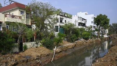 Gurugram, India-March 20, 2023: Natural drain widening work going at Palam Vihar in block-F near Rezang-la chowk, in Gurugram, India, on Monday, 20 March 2023. (Photo by Parveen Kumar/Hindustan Times)(Pic to go with Abhishek's story) Gurugram, India-March 20, 2023: Natural drain widening work going at Palam Vihar in block-F near Rezang-la chowk, in Gurugram, India, on Monday, 20 March 2023. (Photo by Parveen Kumar/Hindustan Times)(Pic to go with Abhishek's story)
