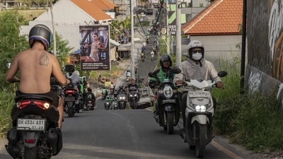 Motorcyclists travel on a street in Canggu, Bali, Indonesia. (Bloomberg) Motorcyclists travel on a street in Canggu, Bali, Indonesia. (Bloomberg)