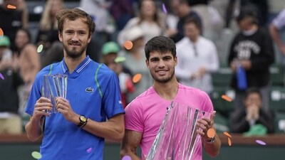 Daniil Medvedev, of Russia, left, and Carlos Alcaraz, of Spain, hold trophies after Alcaraz defeated Medvedev in the men's singles final at the BNP Paribas Open tennis tournament (AP) Daniil Medvedev, of Russia, left, and Carlos Alcaraz, of Spain, hold trophies after Alcaraz defeated Medvedev in the men's singles final at the BNP Paribas Open tennis tournament (AP)