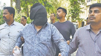Mumbai, India - March 20, 2023: Anil Jaisinghani, bookie from Ulhasnagar, arrested by the Mumbai crime branch from Gujarat’s Godhra. He was named as a co-accused in the case related to the alleged blackmailing of Amruta Fadnavis, wife of deputy CM Devendra Fadnavis, at CP Office, in Mumbai, India, on Monday, March 20, 2023. (Photo by Bhushan Koyande/HT Photo) (HT PHOTO) Mumbai, India - March 20, 2023: Anil Jaisinghani, bookie from Ulhasnagar, arrested by the Mumbai crime branch from Gujarat’s Godhra. He was named as a co-accused in the case related to the alleged blackmailing of Amruta Fadnavis, wife of deputy CM Devendra Fadnavis, at CP Office, in Mumbai, India, on Monday, March 20, 2023. (Photo by Bhushan Koyande/HT Photo) (HT PHOTO)