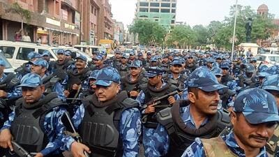 Rapid Action Force (RAF) personnel conducting a flag march to maintain law and order after the arrest of associates of Waris Punjab De chief Amritpal Singh in Jalandhar on Monday. (ANI Photo) Rapid Action Force (RAF) personnel conducting a flag march to maintain law and order after the arrest of associates of Waris Punjab De chief Amritpal Singh in Jalandhar on Monday. (ANI Photo)