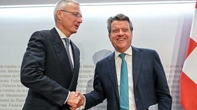 UBS Chairman Colm Kelleher (R) shakes hands with Credit Suisse chairman Axel Lehmann (L) after a press conference. (AFP) UBS Chairman Colm Kelleher (R) shakes hands with Credit Suisse chairman Axel Lehmann (L) after a press conference. (AFP)