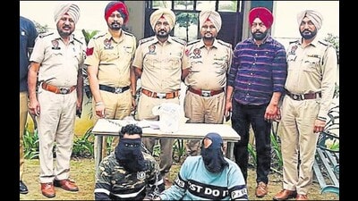 The two men from Jharkhand in police custody in Ludhiana on Monday. (HT Photo) The two men from Jharkhand in police custody in Ludhiana on Monday. (HT Photo)
