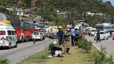 Vehicles stuck in a traffic jam amid closure of Jammu-Srinagar highway due to landslide, in Udhampur on Monday. (ANI Photo)
