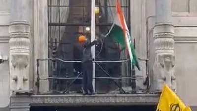 Pro=Khalistani protester pulling down tricolour.