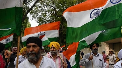 Sikh protesters hold national flags during a protest in New Delhi against the supporters of radical Sikh preacher Amritpal Singh who were filmed vandalising India's consulate in San Francisco, (AFP) Sikh protesters hold national flags during a protest in New Delhi against the supporters of radical Sikh preacher Amritpal Singh who were filmed vandalising India's consulate in San Francisco, (AFP)