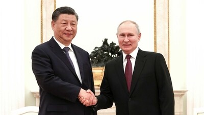 Russian President Vladimir Putin, right, and Chinese President Xi Jinping shake hands prior to their talks at the Kremlin in Moscow, Russia, Monday. (AP) Russian President Vladimir Putin, right, and Chinese President Xi Jinping shake hands prior to their talks at the Kremlin in Moscow, Russia, Monday. (AP)