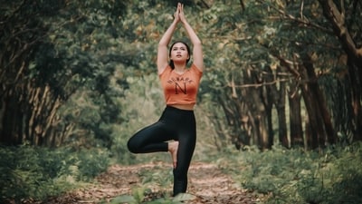 Tree Pose: The Tree Pose, or "Vrikshasana" in Sanskrit, is a balancing pose that is perfect for grounding and centering the body. This pose involves standing on one foot while placing the sole of the other foot on the inner thigh or calf. Arms can be lifted up towards the sky or brought together in front of the heart. This pose is great for improving balance and focus, as well as strengthening the legs and core. (Unsplash) Tree Pose: The Tree Pose, or "Vrikshasana" in Sanskrit, is a balancing pose that is perfect for grounding and centering the body. This pose involves standing on one foot while placing the sole of the other foot on the inner thigh or calf. Arms can be lifted up towards the sky or brought together in front of the heart. This pose is great for improving balance and focus, as well as strengthening the legs and core. (Unsplash)