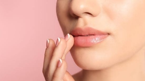 Protect your lips: Apply lip balms and have sufficient water to keep your lips hydrated. (Shutterstock)