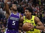 Utah Jazz guard Ochai Agbaji (30) drives against Sacramento Kings guard De'Aaron Fox (5) in the fourth quarter at Vivint Arena. 