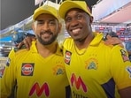 MS Dhoni and DJ Bravo pose for a photo.
