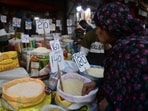 Pakistan Economic Crisis: A woman checks rice prices at a main wholesale market in Karachi. 