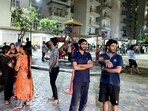 People gather outside their homes after tremors were felt due to an earthquake, in Noida Ext on Tuesday night.