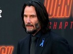 John Wick wore a blue ribbon to honour Lance Reddick. (AP)