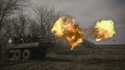 Ukrainian servicemen seen firing an S60 anti-aircraft gun at Russian positions near Bakhmut on March 20. The months-long battle for Bakhmut has become one of the bloodiest of Russia's nearly 13-month-old war in Ukraine. While it is uncertain whether either meeting would change the course of the war, the talks, about 800 kilometers apart, highlight the war’s repercussions for international diplomacy as countries line up behind rival parties. (Aris Messinis / AFP) Ukrainian servicemen seen firing an S60 anti-aircraft gun at Russian positions near Bakhmut on March 20. The months-long battle for Bakhmut has become one of the bloodiest of Russia's nearly 13-month-old war in Ukraine. While it is uncertain whether either meeting would change the course of the war, the talks, about 800 kilometers apart, highlight the war’s repercussions for international diplomacy as countries line up behind rival parties. (Aris Messinis / AFP)
