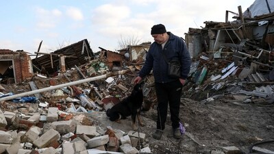 Local resident Volodymyr Alipov, 58, is seen with a dog among the remains of his house destroyed by an airstrike last year during Russia's attack in the village of Tsyrkuny, Kharkiv region, on March 20, In early March, the government issued an order for the compulsory evacuation of families with children from combat areas. (Sofiia Gatilova / REUTERS) Local resident Volodymyr Alipov, 58, is seen with a dog among the remains of his house destroyed by an airstrike last year during Russia's attack in the village of Tsyrkuny, Kharkiv region, on March 20, In early March, the government issued an order for the compulsory evacuation of families with children from combat areas. (Sofiia Gatilova / REUTERS)