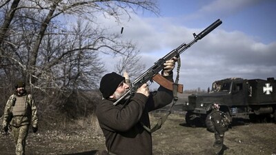 A Ukrainian serviceman is seen shooting down a drone with his rifle, near Bakhmut, on March 20. Russia has made the capture of Bakhmut a priority in its strategy to take control of Ukraine's Donbas industrial region. If Russian forces capture Bakhmut, it will be Moscow's first significant territorial gain since last summer, Reuters reported. (Aris Messinis / AFP) A Ukrainian serviceman is seen shooting down a drone with his rifle, near Bakhmut, on March 20. Russia has made the capture of Bakhmut a priority in its strategy to take control of Ukraine's Donbas industrial region. If Russian forces capture Bakhmut, it will be Moscow's first significant territorial gain since last summer, Reuters reported. (Aris Messinis / AFP)
