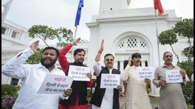 AAP lawmakers protest against the Union government at the Delhi assembly. (PTI) AAP lawmakers protest against the Union government at the Delhi assembly. (PTI)