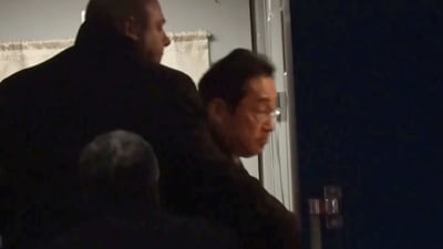 Japanese Prime Minister Fumio Kishida gets on train in Przemysl, Poland, heading to Kyiv. (NTV via AP)