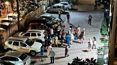 People gather outside their homes after tremors were felt due to an earthquake, in Noida, (PTI) People gather outside their homes after tremors were felt due to an earthquake, in Noida, (PTI)