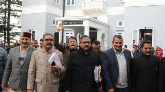 BJP legislators stage a walkout from the assembly during the budget session in Shimla on Tuesday. (Deepak Sansta/HT)