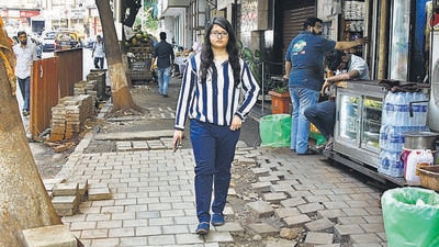 Freya Mistry says on the entire 400-meter stretch between Bhagwan Parshwanath Chowk and Nana Chowk circle, the paver blocks and tiles have either come apart or are strewn around. There are patches of mud and sand lying at intervals. Whatever is left has been claimed by vegetable and fruit vendors. (Bhushan Koyande/HT PHOTO) Freya Mistry says on the entire 400-meter stretch between Bhagwan Parshwanath Chowk and Nana Chowk circle, the paver blocks and tiles have either come apart or are strewn around. There are patches of mud and sand lying at intervals. Whatever is left has been claimed by vegetable and fruit vendors. (Bhushan Koyande/HT PHOTO)