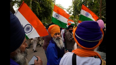 Indian Sikhs protesting against the pulling down of Indian flag from the Indian High Commission building in London gather with Indian flags outside the British High Commission in New Delhi. (AP photo) Indian Sikhs protesting against the pulling down of Indian flag from the Indian High Commission building in London gather with Indian flags outside the British High Commission in New Delhi. (AP photo)