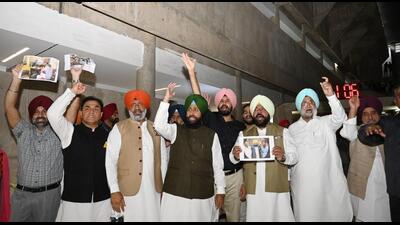 Punjab Congress MLAs, led by Partap Singh Bajwa, raising slogans against Speaker Kultar Singh Sandhwan and chief minister Bhagwant Mann after their adjournment motion on law and order was disallowed in the Vidhan Sabha on Wednesday. The MLAs walked out of the assembly in protest. (Ravi Kumar/HT) Punjab Congress MLAs, led by Partap Singh Bajwa, raising slogans against Speaker Kultar Singh Sandhwan and chief minister Bhagwant Mann after their adjournment motion on law and order was disallowed in the Vidhan Sabha on Wednesday. The MLAs walked out of the assembly in protest. (Ravi Kumar/HT)