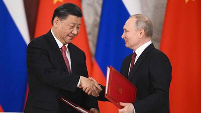 Russian President Vladimir Putin (right) and China’s President Xi Jinping shake hands during a signing ceremony following their talks at the Kremlin in Moscow on Tuesday. (AFP) Russian President Vladimir Putin (right) and China’s President Xi Jinping shake hands during a signing ceremony following their talks at the Kremlin in Moscow on Tuesday. (AFP)