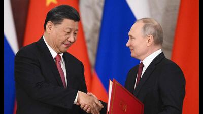 Russian President Vladimir Putin and China's President Xi Jinping shake hands during a signing ceremony following their talks at the Kremlin in Moscow on March 21, 2023 (AFP) Russian President Vladimir Putin and China's President Xi Jinping shake hands during a signing ceremony following their talks at the Kremlin in Moscow on March 21, 2023 (AFP)