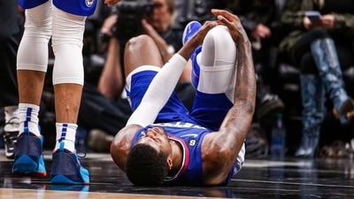Los Angeles Clippers forward Paul George, right, lies on the court after an injury during the second half of an the team's NBA basketball game against the Oklahoma City Thunder on Tuesday, March 21, 2023, in Los Angeles. (AP) Los Angeles Clippers forward Paul George, right, lies on the court after an injury during the second half of an the team's NBA basketball game against the Oklahoma City Thunder on Tuesday, March 21, 2023, in Los Angeles. (AP)