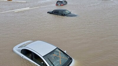 California Bomb Cyclone: Cars sit abandoned on roads as floodwaters from the Tule River inundate the area after days of heavy rain, in Corcoran, California. (Reuters)