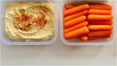 Carrot Sticks with Hummus: Cut up some fresh carrot sticks and serve with a small bowl of hummus for dipping. Carrots are a low-calorie vegetable packed with nutrients, while hummus is a protein-rich dip. (Pexels) Carrot Sticks with Hummus: Cut up some fresh carrot sticks and serve with a small bowl of hummus for dipping. Carrots are a low-calorie vegetable packed with nutrients, while hummus is a protein-rich dip. (Pexels)
