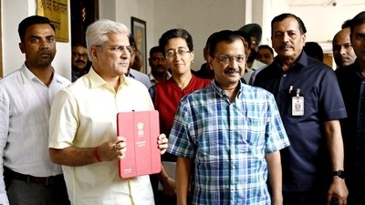 Delhi CM Arvind Kejriwal with cabinet minister, ahead of budget presentation on Wednesday.