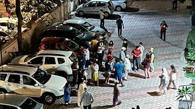 Earthquake In India: People gather outside their homes after tremors were felt due to an earthquake, in Noida, (PTI) Earthquake In India: People gather outside their homes after tremors were felt due to an earthquake, in Noida, (PTI)