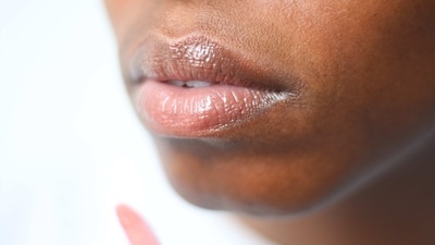 Exfoliate regularly: Dead skin cells can accumulate around the lips, making them appear darker. Regular exfoliation can help remove these dead skin cells and reveal brighter, smoother skin. You can use a lip scrub or gently brush your lips with a soft toothbrush to exfoliate. (Unsplash) Exfoliate regularly: Dead skin cells can accumulate around the lips, making them appear darker. Regular exfoliation can help remove these dead skin cells and reveal brighter, smoother skin. You can use a lip scrub or gently brush your lips with a soft toothbrush to exfoliate. (Unsplash)
