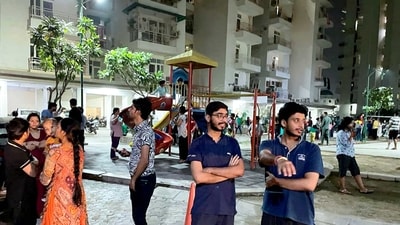 People gather outside their homes after tremors were felt due to an earthquake, in Noida Ext on Tuesday night. (PTI) People gather outside their homes after tremors were felt due to an earthquake, in Noida Ext on Tuesday night. (PTI)