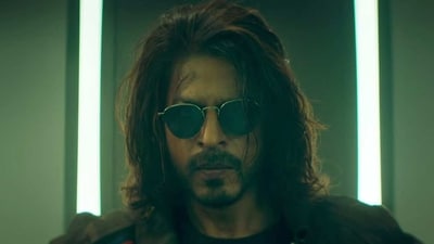Shah Rukh Khan makes a stylish entry in a scene from Pathaan. Shah Rukh Khan makes a stylish entry in a scene from Pathaan.