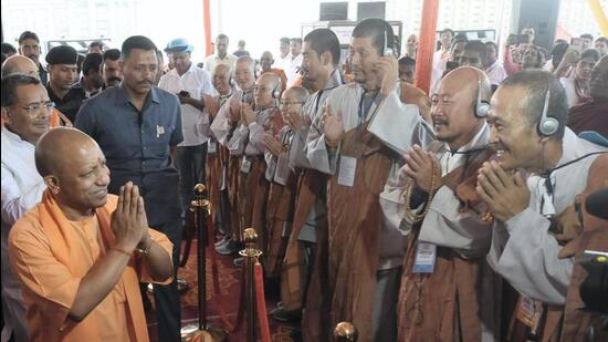 Uttar Pradesh chief minister Yogi Adityanath during a felicitation programme for South Korea’s Jogye Buddhist pilgrims on the success of their pilgrimage, in Lucknow on Wednesday. (PTI PHOTO)