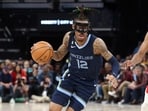Memphis Grizzlies guard Ja Morant (12) drives to the basket.