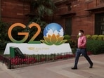 A man walks past a model of G20 logo outside the finance ministry in New Delhi, India. Second G20 Tourism Working Group meeting to be held in Siliguri, Darjeeling from April 1, 2023. 