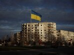  A Ukrainian national flag flutters near the buildings destroyed by Russian military strike, amid Russia's invasion of Ukraine, in the town of Borodianka in Kyiv.
