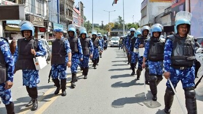 Rapid Action Force (RAF) personnel conduct a flag march to maintain law and order after the arrest of associates of Waris Punjab De chief Amritpal Singh, in Jalandhar. (Sunny Sehgal) Rapid Action Force (RAF) personnel conduct a flag march to maintain law and order after the arrest of associates of Waris Punjab De chief Amritpal Singh, in Jalandhar. (Sunny Sehgal)